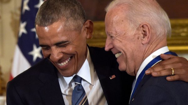 Biden receives the medal via Obama.