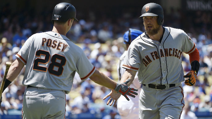 Buster+Posey+and+Hunter+Pence+high+five+in+their+game+against+the+LA+Dodgers.