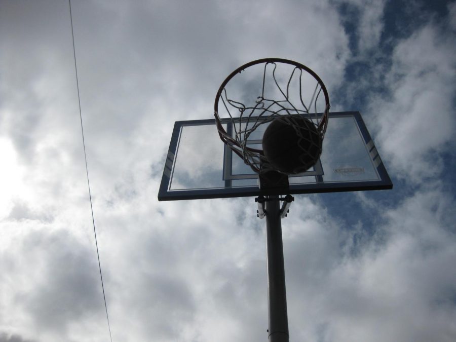 Playing basketball in the street.