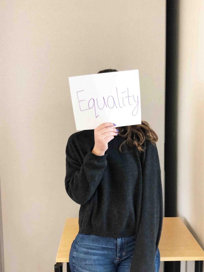 A Woodside student shows her support for feminism.