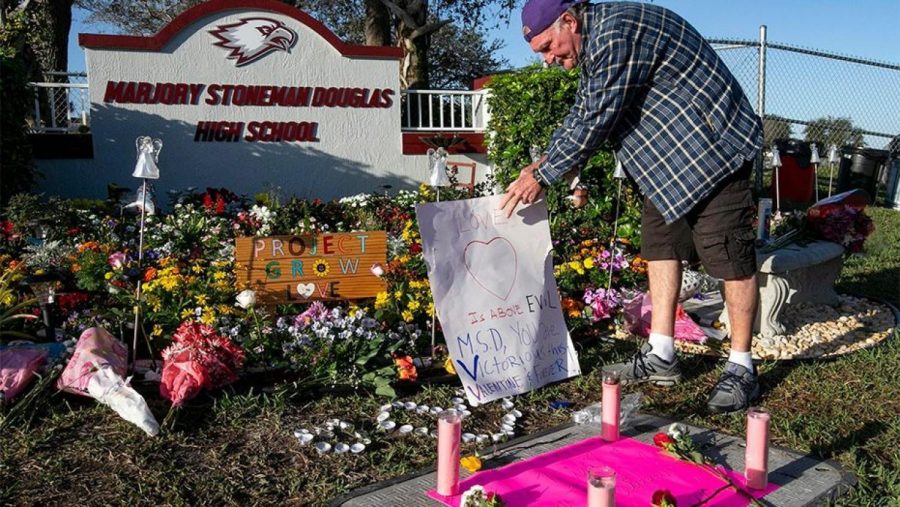 Adults and children gathered at Marjory Stoneman Douglas High School to mourn as a community.