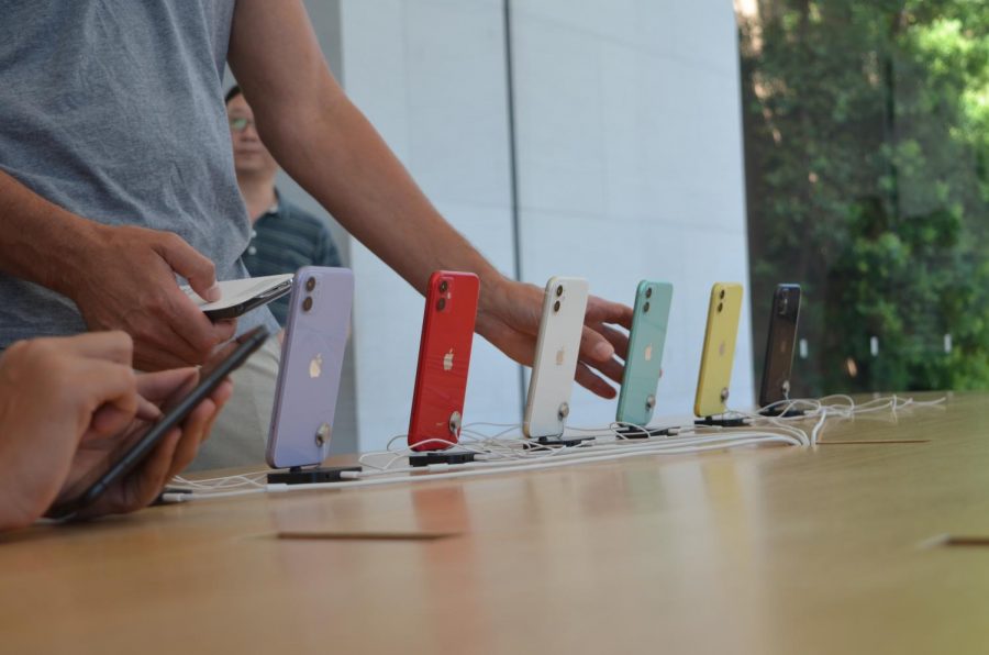 A man grabs an iPhone 11 on September 21st, 2019 at the Stanford Mall Apple Store in Palo Alto. The iPhone 11 has the most color choices out of any iPhone, now coming in new colors like purple, white, green, and yellow, and familiar colors like red and black.