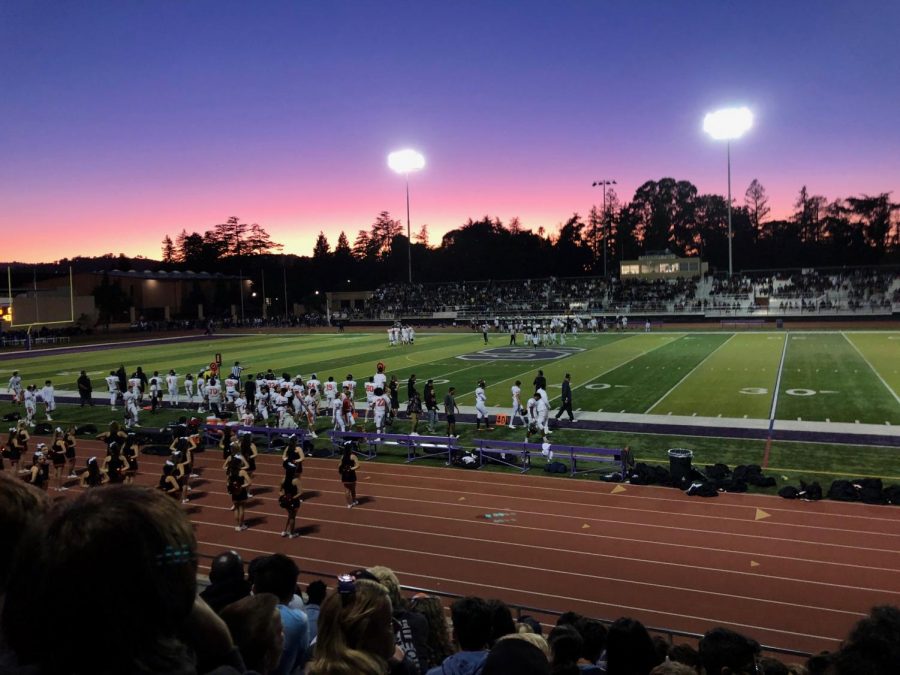 People in the crowd watched the sunset as the teams huddled to plan their next moves.