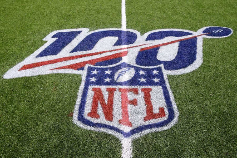The NFL 100th season anniversary logo is displayed on the field.