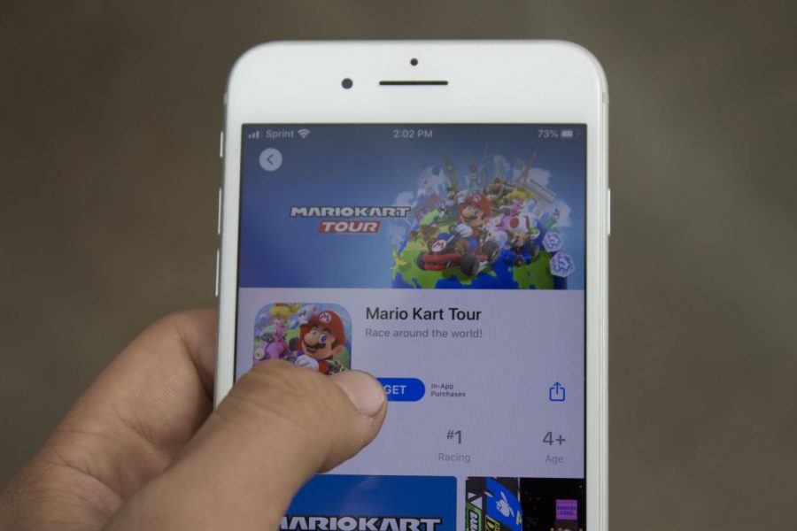 A student downloads the  
Mario Kart Tour mobile app on their phone.