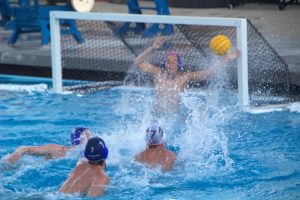 Woodside blocks their opposing team, Menlo-Atherton, from scoring a goal.