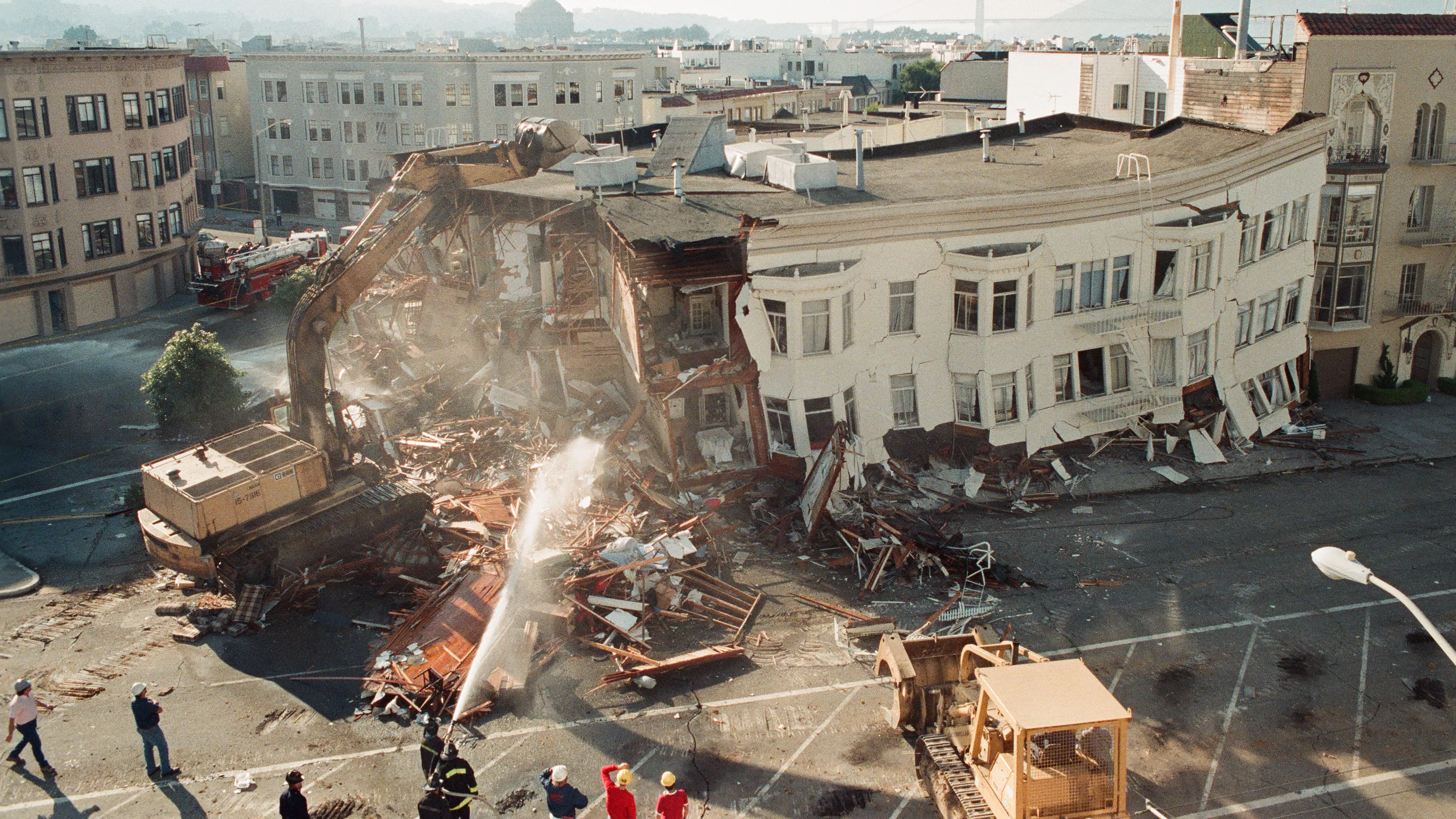 An apartment building collapses from the force of the Loma Prieta earthquake on October 17, 1989.