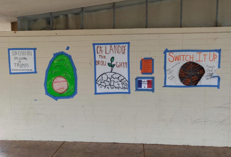 A poster advertising French Club is taped to a wall near the Quad, one of Woodside High Schools most populated areas. Surrounding it are various other posters about school spirit and how to help the environment.