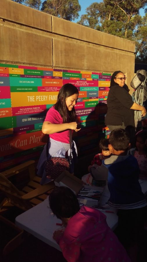 Grace Jau volunteers at an arts-and-crafts program for young children.