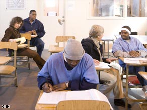 Inmates at the San Quentin State Prison working with tutors.