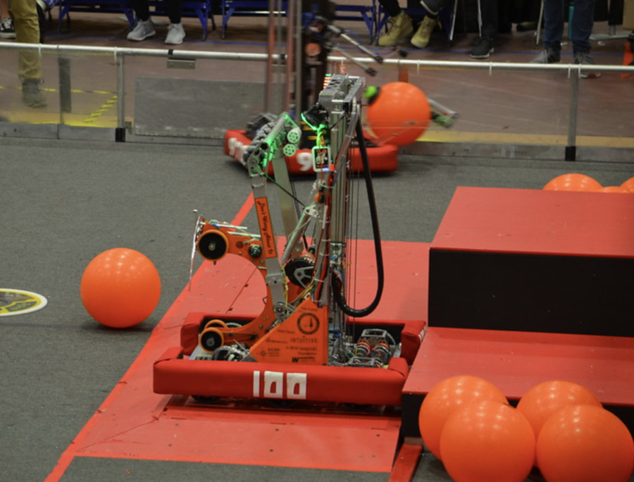 A+past+challenge+at+a+robotics+competition+was+for+the+robot+to+move+a+ball+into+a+hoop.