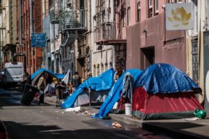 A single row of tents stand in the backstreets of San Franciscos Tenderloin district.