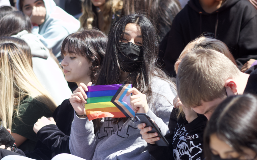 Woodside student poses with the pride flag during Woodsides rally which highlighted identity. 