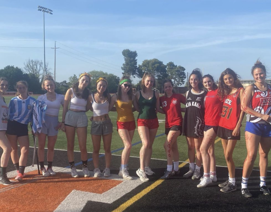 The girls lacrosse team commonly participates in team bonding exercises like spirit days to build team spirit and competitiveness. 