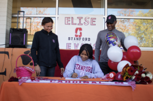 Similar to her sister, Evans officiated her commitment to Stanford University at Woodside High school during a lunchtime ceremony put together by Woodside High school and was joined by her parents Dena Evans (left) and Marlon Evans (right).