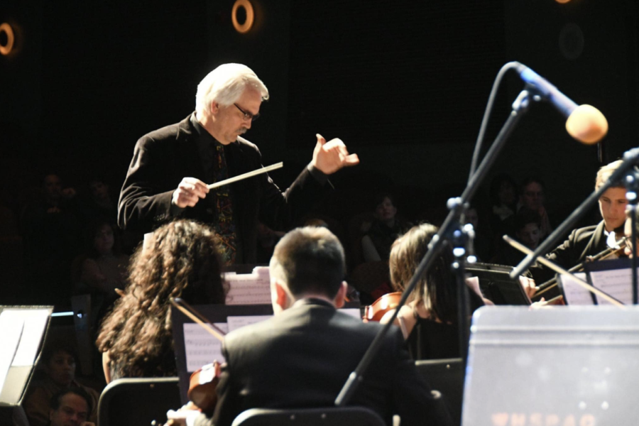 Tolles+conducts+orchestra+during+his+final+Spring+concert.+Tolles+presented+six+ensembles+with+over+24+pieces+preformed%2C+equating+to+over+three+hours+of+music.