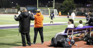 Woodside boys soccer varsity coach Darrell Ringman (left) and junior varsity coach Jorge Moreno, watching the away game at Sequoia, which resulted in a 0-1 loss for varsity and a 2-1 victory for junior varsity