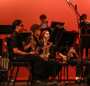 The big band performs upbeat jazz pieces with excellent solos sprinkled throughout.