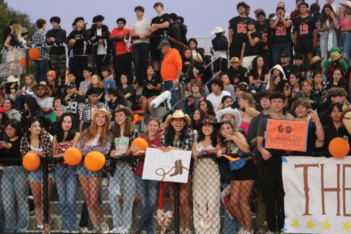 The+student+section+at+the+first+football+game+is+all+smiles+with+their+rodeo-themed+apparel.+