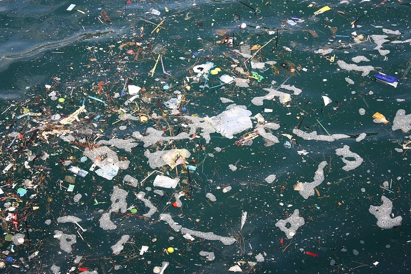 The ocean being consumed by lots of plastic and waste.