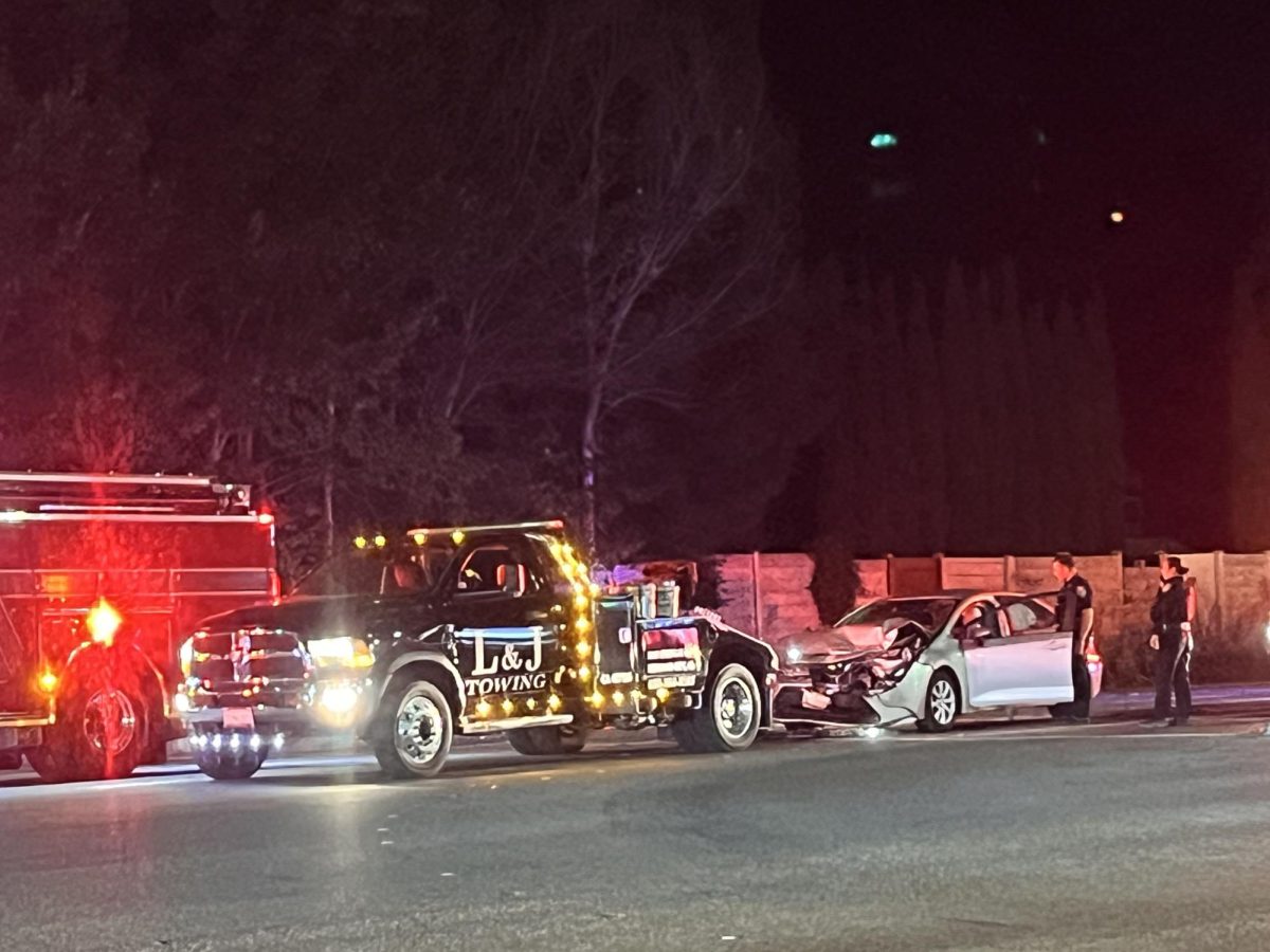 L&J Towing tows away silver car with crushed in front.