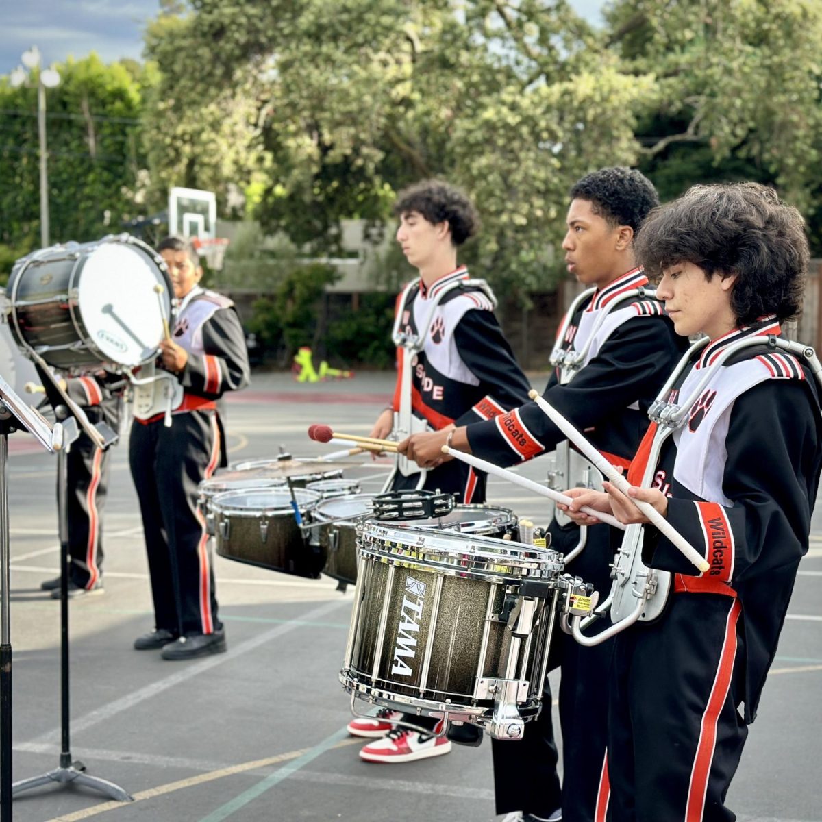 Woodside's marching band's first performance of the year was at St. Raymond's church and school carnival.