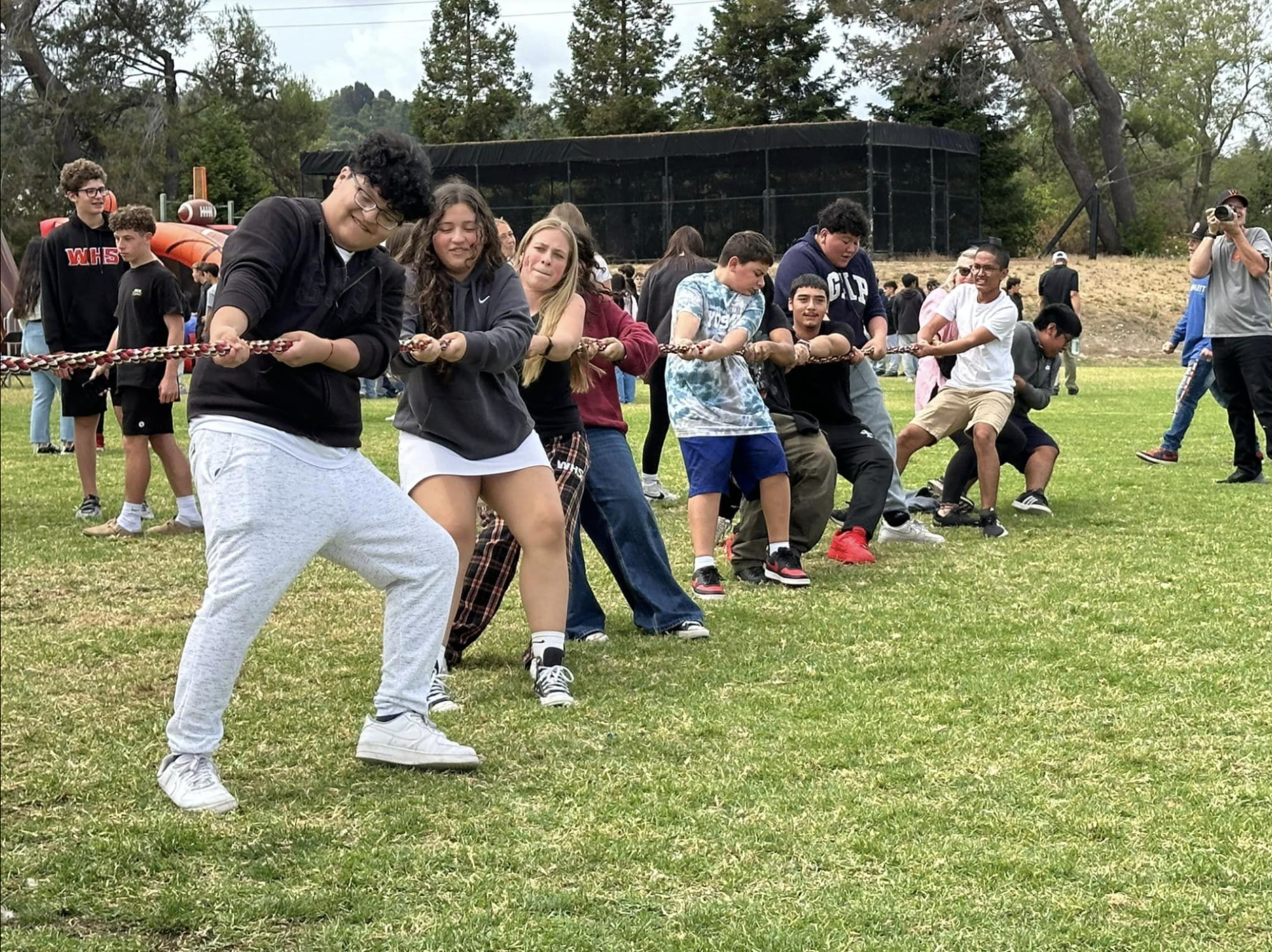 Students playing a game of tug a war at field day.