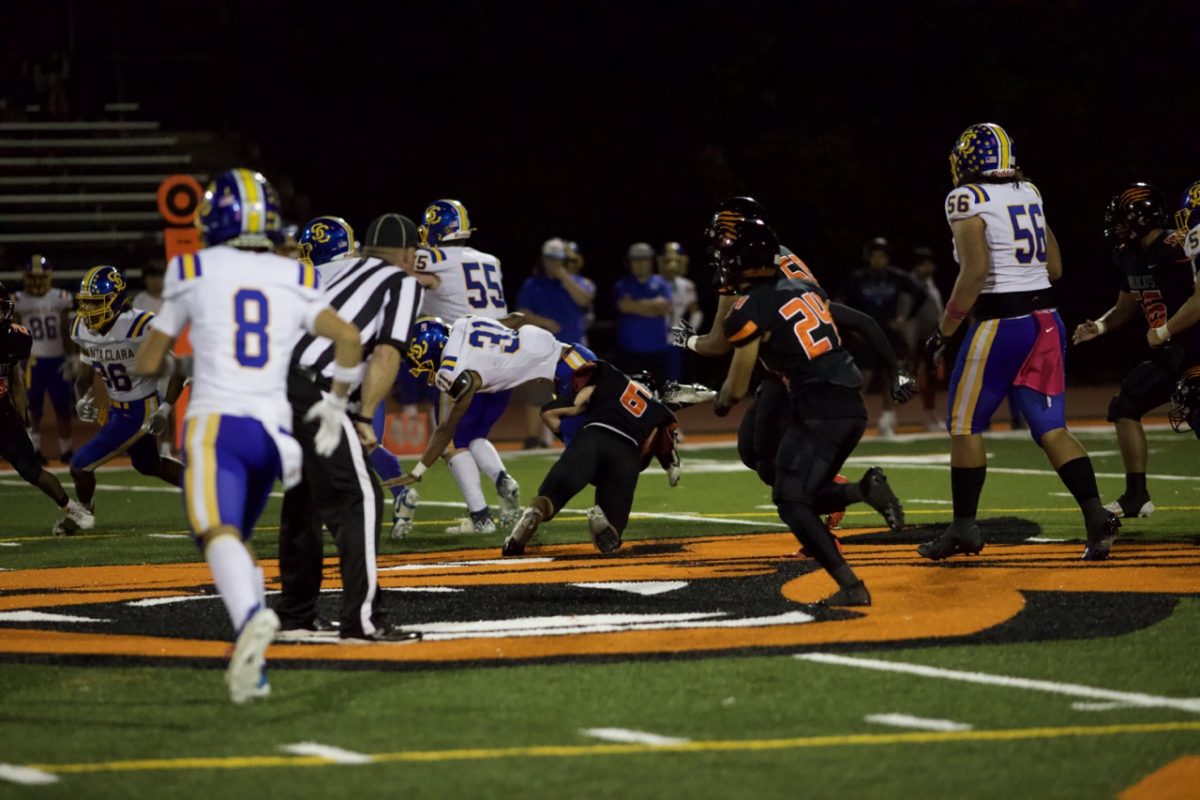 Junior football player Jack Bouman taking the tackle during the Homestead game.