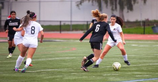 Woodside girls soccer players training on Bradley Field during practice.
