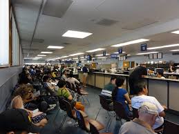 People wait in long lines for their service at the DMV