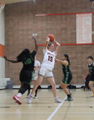 Junior Mo Overbey on Woodside girls varsity on offense in a recent match
