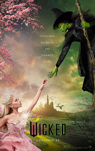 "Wicked" movie poster, with main protagonists, Glinda and Elphaba reaching for each other.