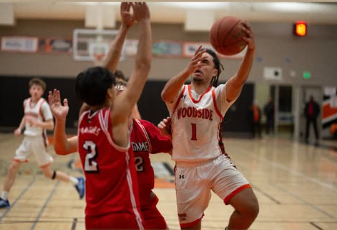 Woodside guard Isaac Wagner goes up for a layup