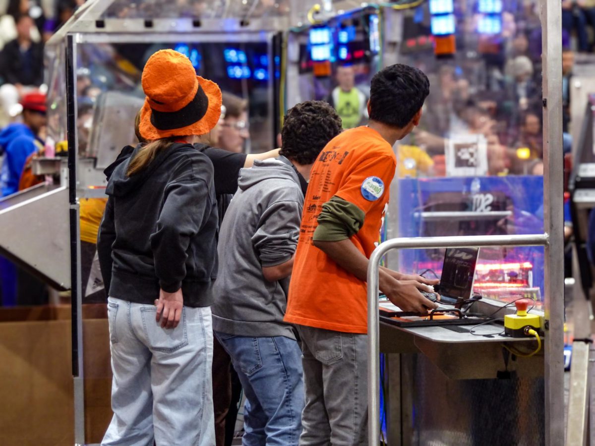 A photo of Team 100 Wildhats at a previous robotics competition.
