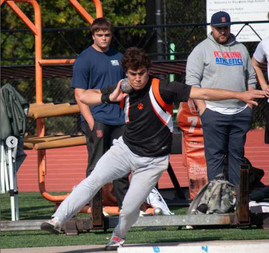 Evan Usher throwing shot put for Woodside at the Woodside jamboree.