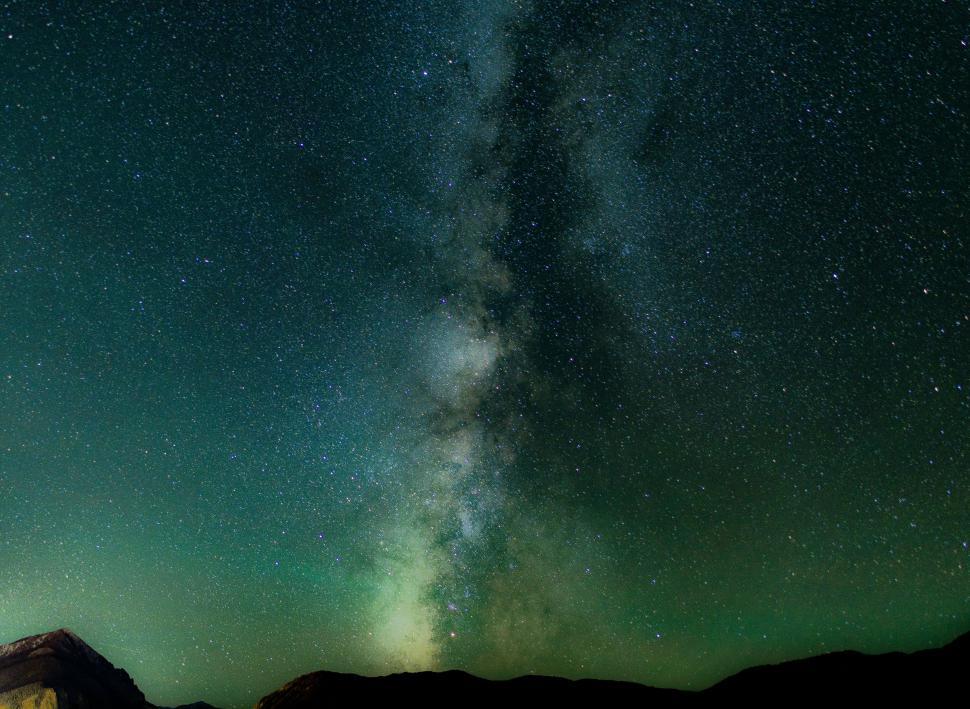 The night sky with less light pollution, showing stars and the Milky Way.