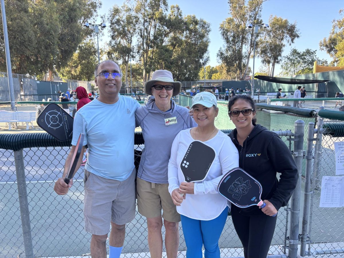 Many different people play pickleball at Mitchell Park, home of the Palo Alto Pickleball Club.
