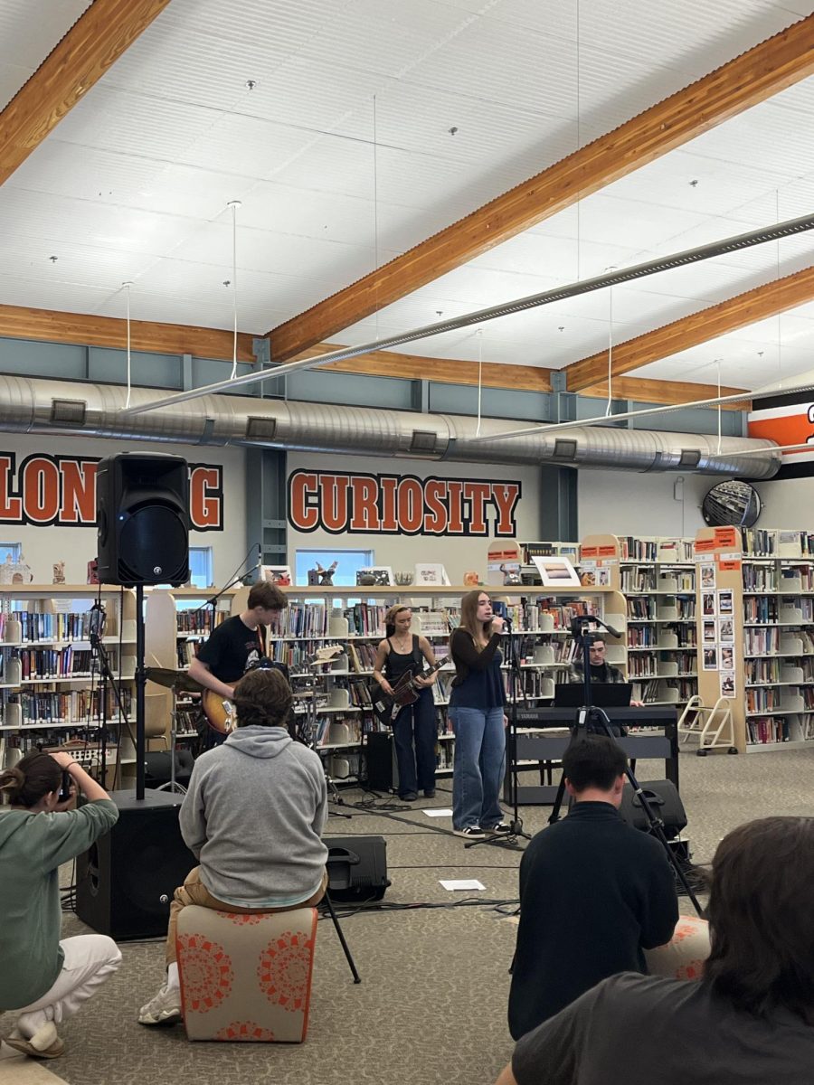 199 Records performs the "Tiny Desk" concert in front of a crowd of Woodside students.