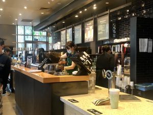 Inside a Starbucks Coffee Shop during the busy morning rush. 