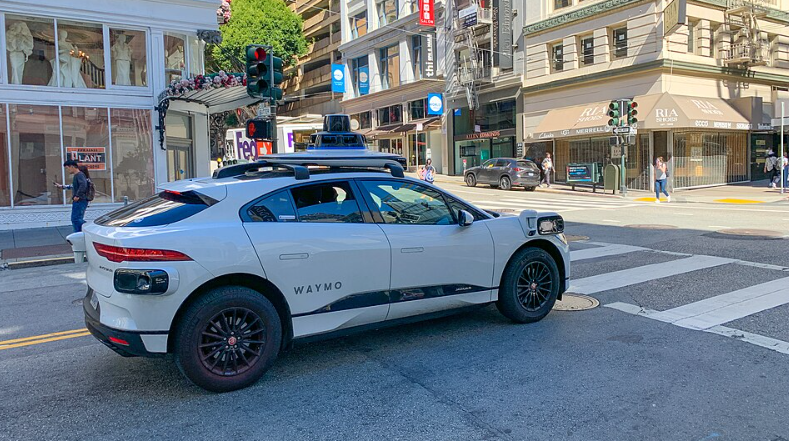 This is an image of a Waymo car in action, navigating around the city.

