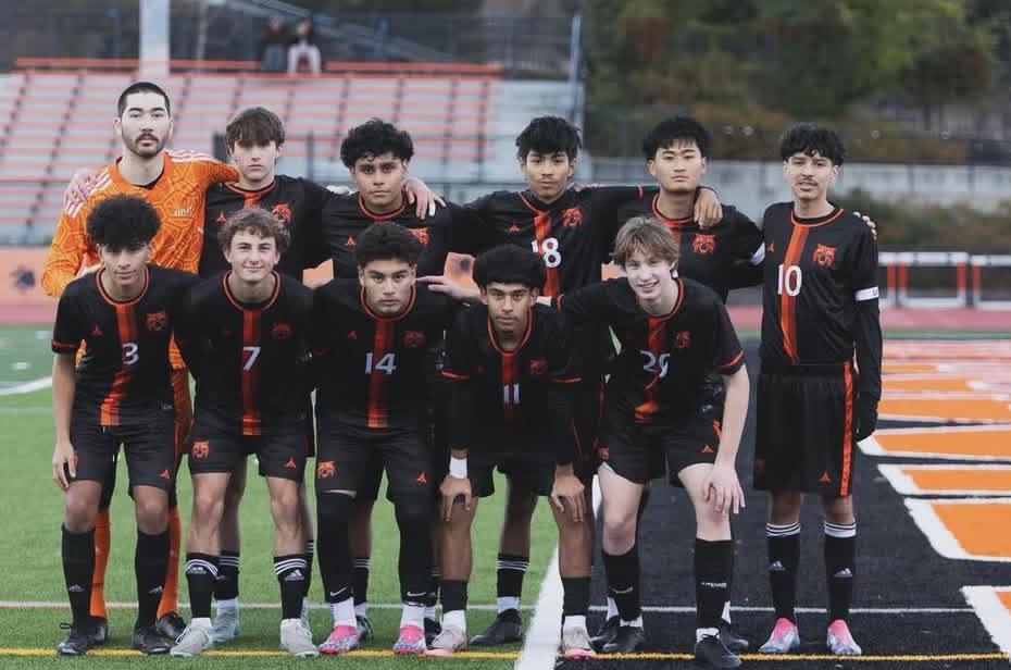 Boys' soccer takes a picture on Bradley field at the start of the season