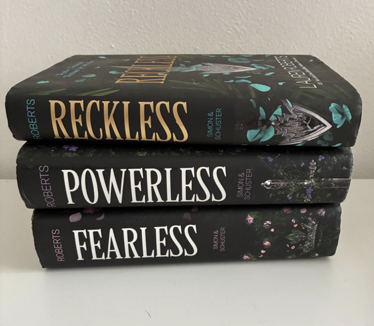 All books from Lauren Robert's Powerless trilogy, popular among young adult readers. 