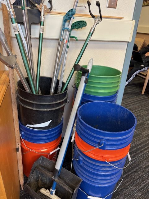 Picture taken of the numerous buckets and grabbers provided for students during trash pick ups.
