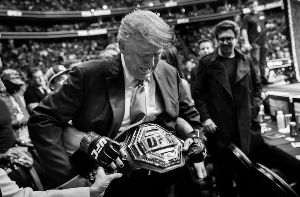 Donald Trump wearing a UFC championship belt after a fight.