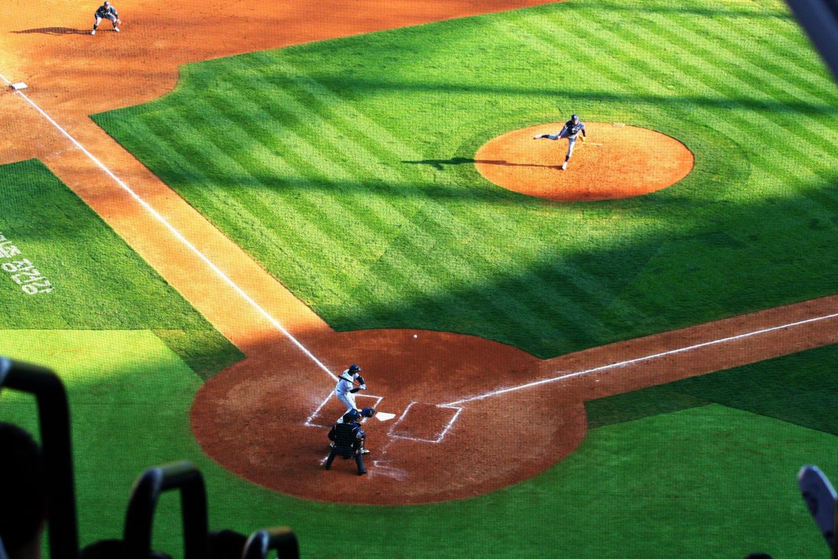 A player taking a swing at the ball during a Major League Baseball game.