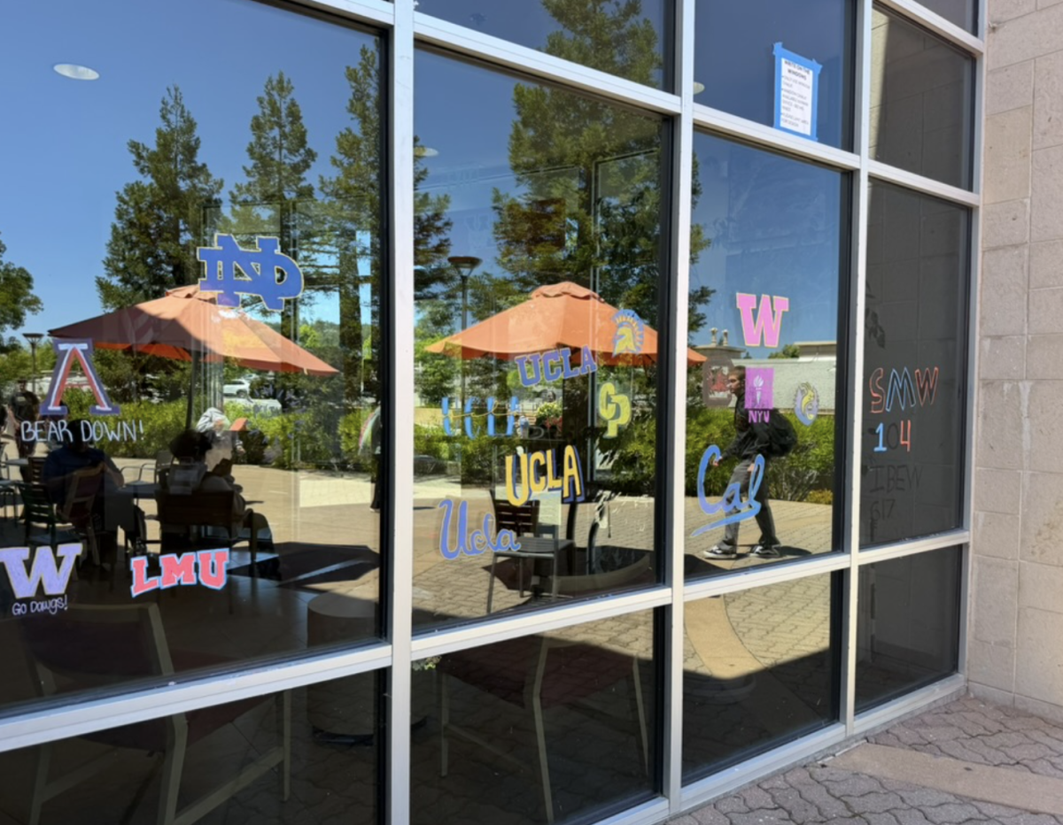 Seniors at Woodside continue the tradition of drawing the logos of their next steps on the Office building. 
